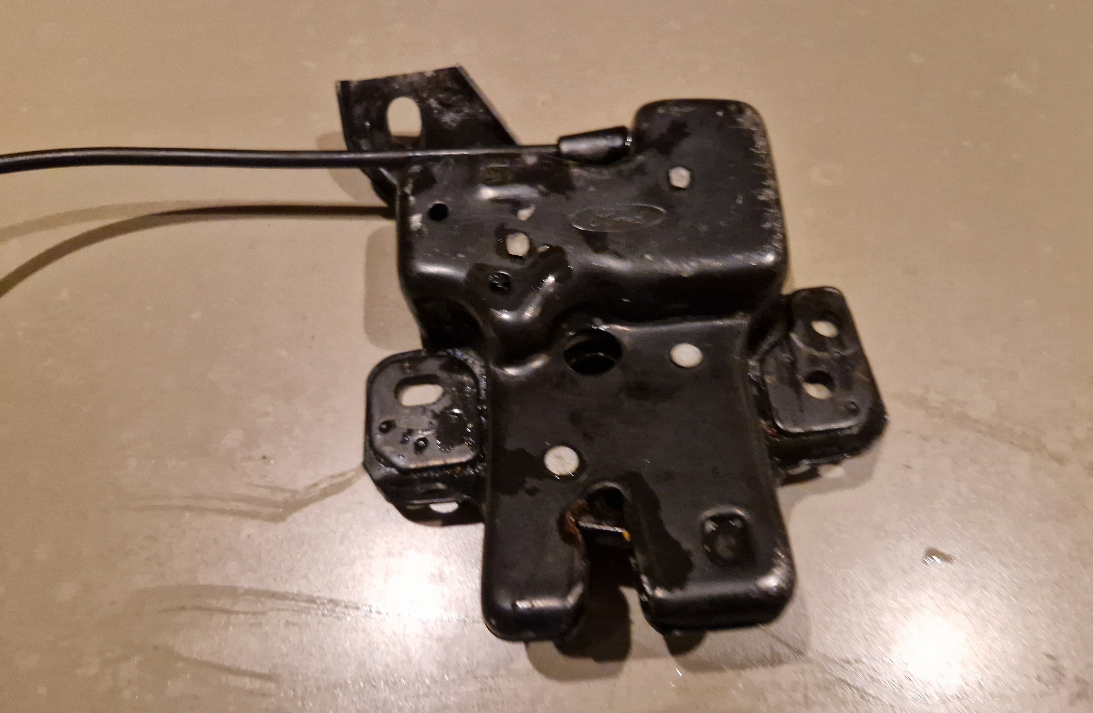 Ontgrendelmechanisme achterklep